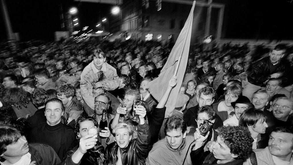 Ossis and Wessis party together on November 9 1989.