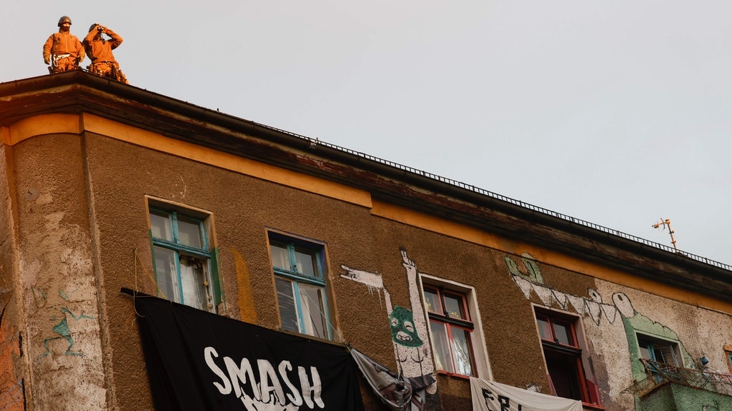 Police on the roof of the Liebig34 building on Friday morning.
