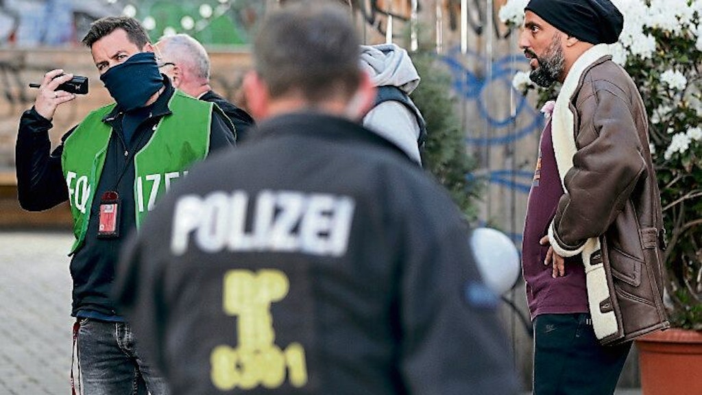 Comedian Abdelkarim, right, with officers after the attack. 