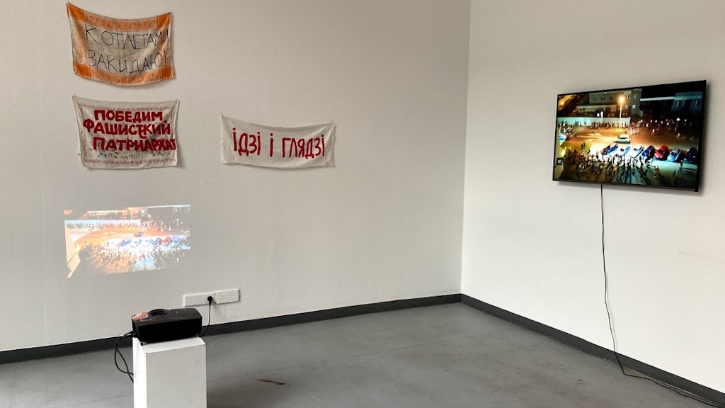 Protest signs made from tea towels from part of "August", Naprushkina's personal response to ongoing pro-democracy protests in her home country of Belarus.