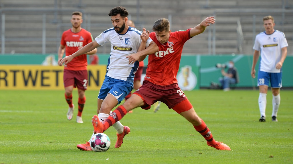 Tolcay Cigerci (l.) und die VSG Altglienicke hatten gegen den 1. FC Köln keine Chance.