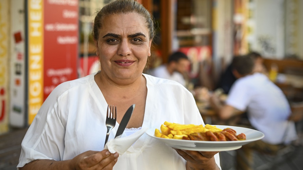 Shop owner Dilber Dogan says the couple are "stuck in the middle" between German and Turkish identities – but they have always enjoyed serving up ethically produced German classics.