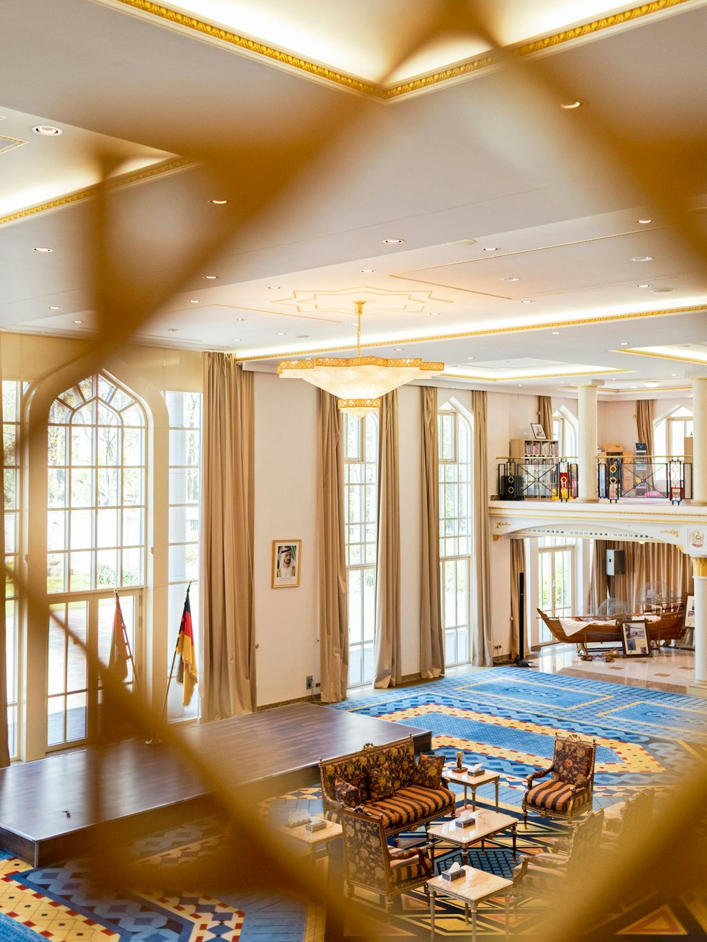The large reception hall of the embassy. A traditional fishing boat is on display in the background. 